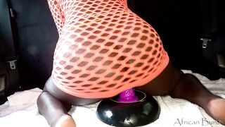 African Slut Riding Huge Dildo In The Car